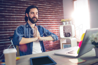 Businessman with hand clasped doing yoga