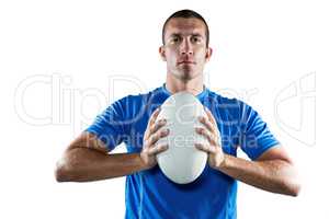 Portrait of confident sports player in blue jersey holding ball