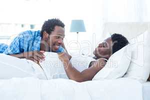 Smiling husband looking at his wife while relaxing