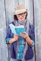 Happy hipster reading a book