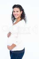 Portrait of happy pregnant woman holding abdomen