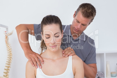 Doctor doing neck adjustment