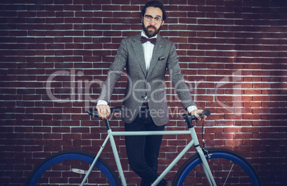 Portrait of smart confident man with bicycle Portrait of smart confident man with bicycle