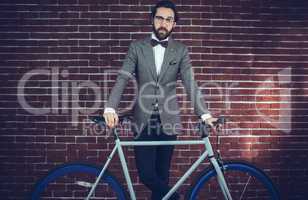 Portrait of smart confident man with bicycle
