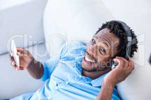 High angle portrait of man listening to music