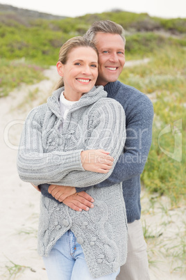 Smiling couple holding each other Smiling couple holding each other