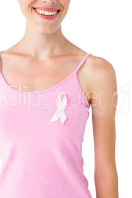 Woman wearing pink ribbon for breast cancer awareness