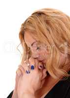 Blond business woman praying with closed eye's.