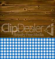 Rustikaler Hintergrund Holz und blaue Tischdecke