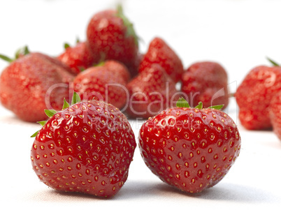 Two fresh ripe red strawberries