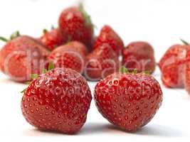 Two fresh ripe red strawberries