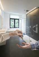 Realtor giving house key to buyer in Luxury Bathroom