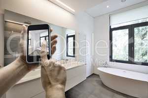 Mobile device with man hands taking picture