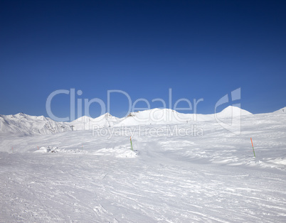 Ski slope at sun day