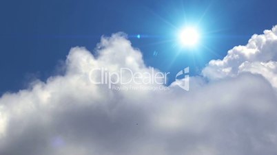Great white clouds with sun over the clean deep blue sky. Time lapse