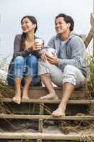 Asian Man Woman Couple Drinking Coffee Beach Steps