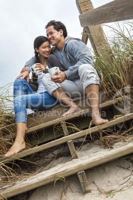 Asian Man Woman Couple Drinking Coffee on Beach Steps