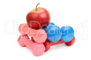 Set dumbbells and apple