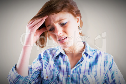 Composite image of pretty brunette getting a headache