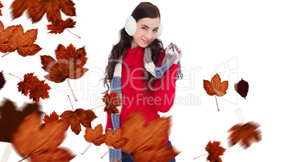 Composite image of happy brunette in winter clothes posing