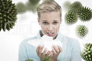 Composite image of blonde sick woman holding lots of tissues