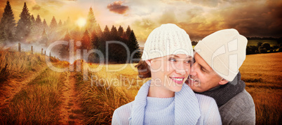 Composite image of casual couple in warm clothing