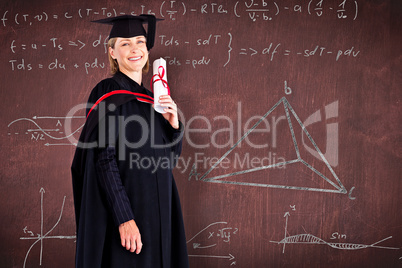 Composite image of confident graduated woman looking at the came