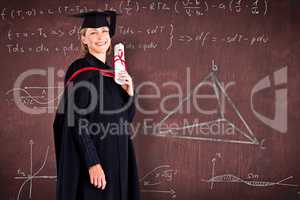 Composite image of confident graduated woman looking at the came