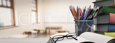 Composite image of school supplies on desk