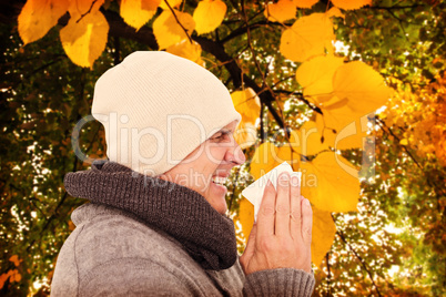 Composite image of casual man about to sneeze