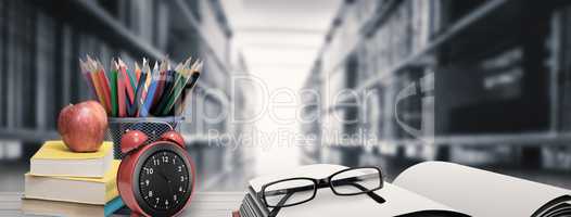 Composite image of school supplies on desk