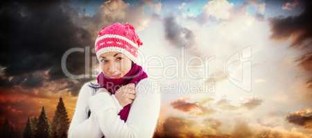 Composite image of attractive woman wearing warm clothes
