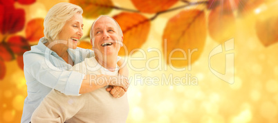 Composite image of happy mature couple smiling at each other