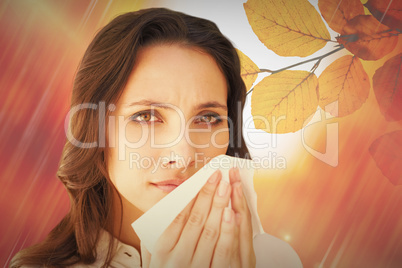 Composite image of brunette with a cold