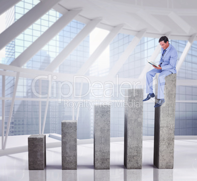 Composite image of businessman reading book while sitting over w