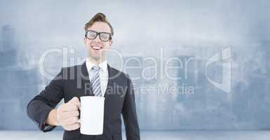 Composite image of happy geeky businessman holding coffee mug
