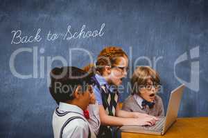 Back to school against blue chalkboard