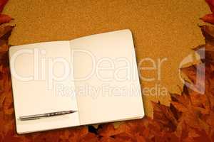 Composite image of notebook and pen