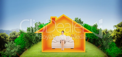 Composite image of smiling well dressed woman sitting on sofa