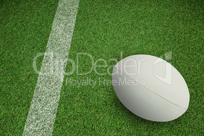 Composite image of close-up of rugby ball