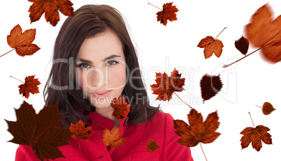 Composite image of portrait of a beautiful brunette in red coat