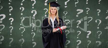 Composite image of blonde student in graduate robe holding her d