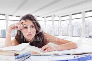 Composite image of bored student doing her homework