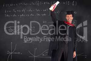 Composite image of smiling handsome boy showing his diploma to t