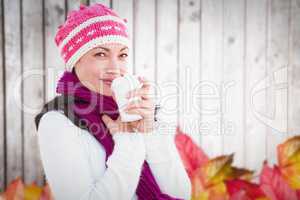 Composite image of woman holding coffee cup