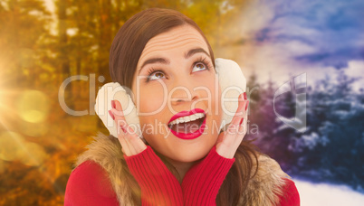 Composite image of surprised brunette in winter clothes