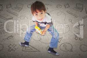 Composite image of cute boy sitting with building blocks