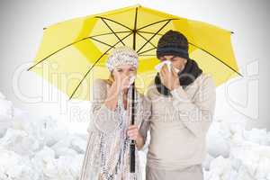 Composite image of couple sneezing in tissue while standing unde
