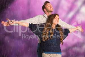 Composite image of romantic young couple with arms out
