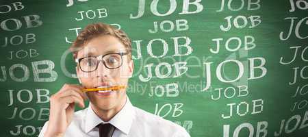 Composite image of geeky businessman biting a pencil